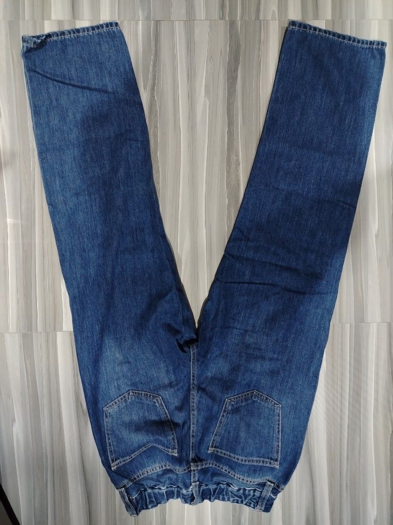 Blue denim straight leg jeans with garterized back (Category: Jeans) located in Quezon City. Submitted by stacey_bluey (Listing ID 1471162992, Image 2). Description: - Style: Straight leg cut - Wash: Medium wash with subtle thigh fading - Details: Classic five-pocket style - Closure: Button and zipper fly - Back: Stitched back pockets - Fit: Comfortable for everyday wear.