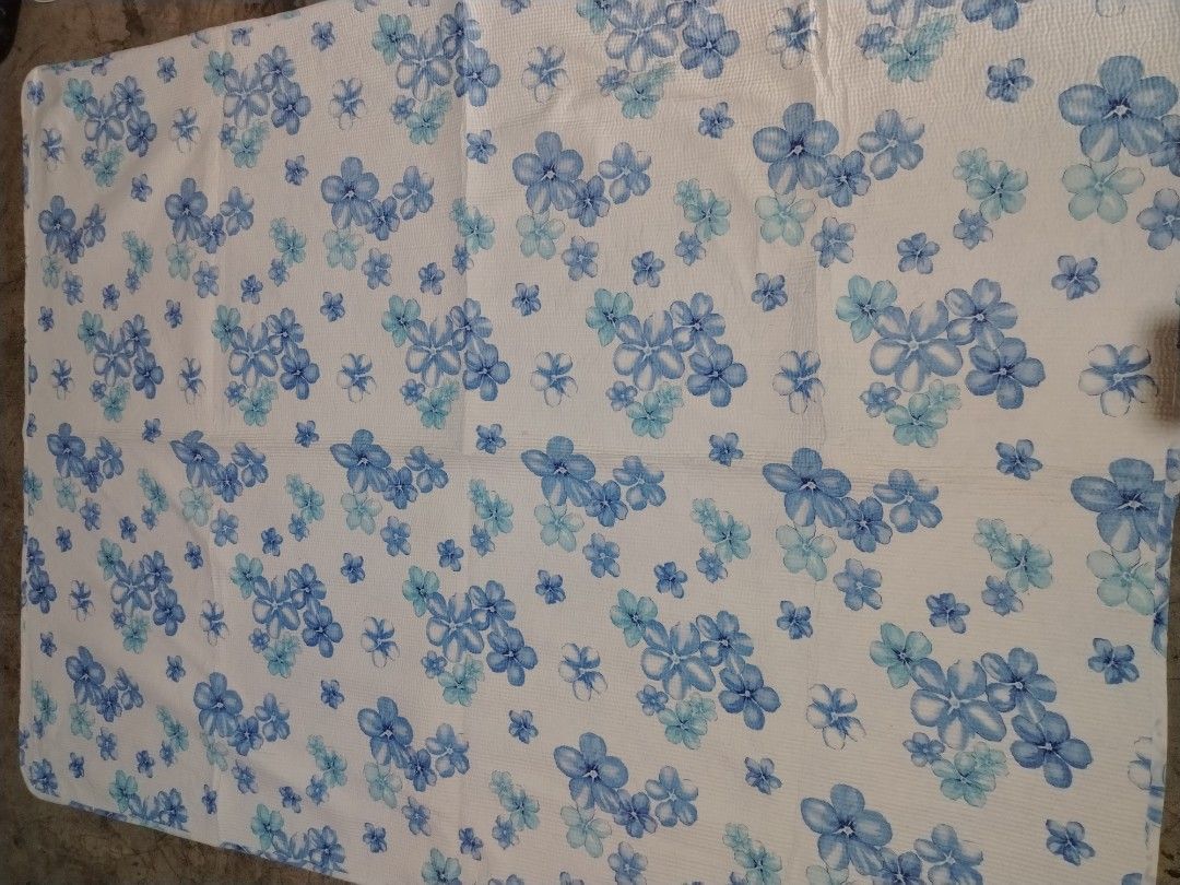 Blue floral pattern bed sheet blanket (Category: Bedding & Towels) located in Manila. Submitted by mimachelleukay (Listing ID 1471258163, Image 1). Description: - Design: White background with charming blue and light blue floral print - Size: Fits double or queen-sized mattresses easily - Material: Lightweight, textured grid fabric with clean edges - Condition: Freshly washed and ready for use.