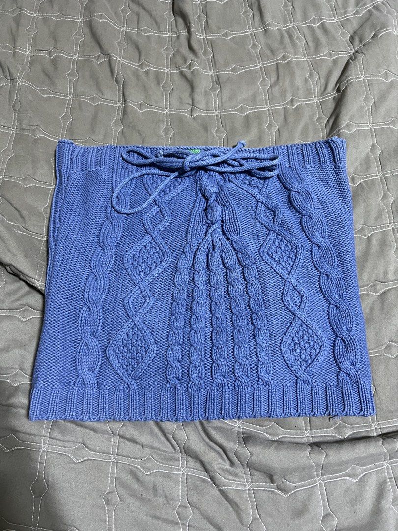 Blue Knit Halter Top With Cable Knit Design (Category: Sleeveless) located in Bacolod City. Submitted by strawberrymochi1201 (Listing ID 1471258168, Image 1). Description: - Color: Periwinkle blue - Style: Halter neckline with adjustable drawstrings - Front Design: Detailed cable knit pattern - Back Design: Fully ribbed for extra texture and stretch - Material: Thick, cozy knit - Versatility: Great for layering or wearing on its own.