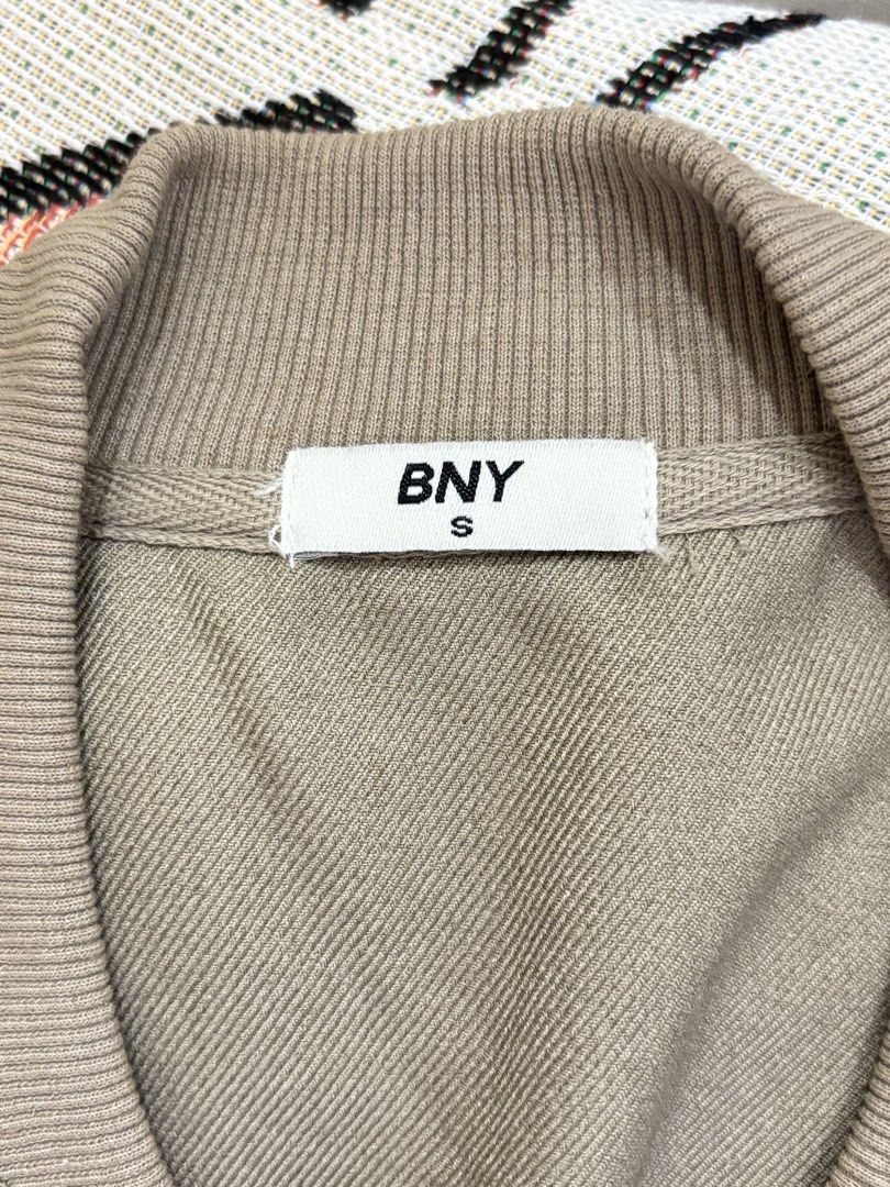 BNY Bomber Jacket Size S (Category: Coats, Jackets and Outerwear) located in Quezon City. Submitted by MyJanuary (Listing ID 1471120308, Image 2). Description: - Brand: BNY - Style: Bomber jacket - Color: Tan/Brown - Size: Small (S) - Closure: Snap button front - Pockets: Two side pockets - rfs: not my style anymore - Condition: Clean and ready to wear Negotiable. Offer lang po Mop: gcash Mod: jnt 📍fairview commonwealth.