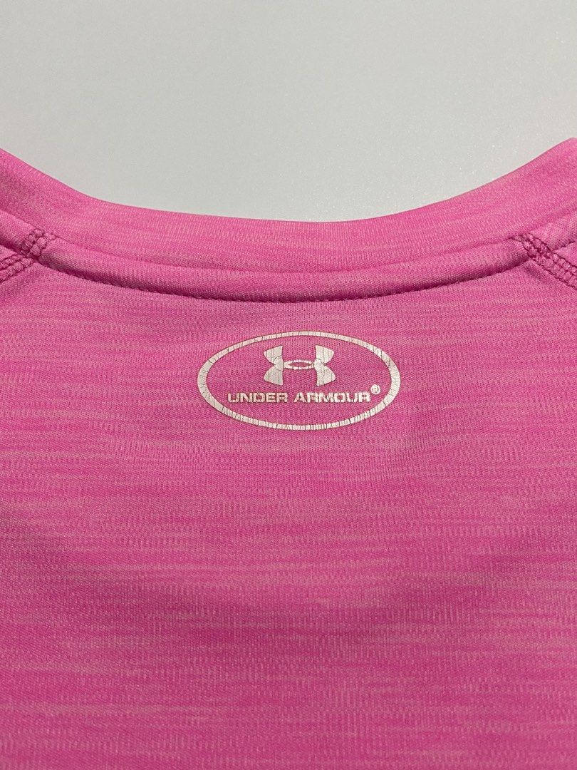 Bright Pink Under Armour Drifit Shirt (Category: Activewear) located in Davao. Submitted by sb.thriftwear (Listing ID 1471146539, Image 3). Description: Size: L-XL Dimensions: W- 19.5” L- 26” Issue: Hairline on front and back print, and pinhole at the back (see photos) Color may vary due to lighting. ⚠️All items are thrifted. Please manage your expectations..