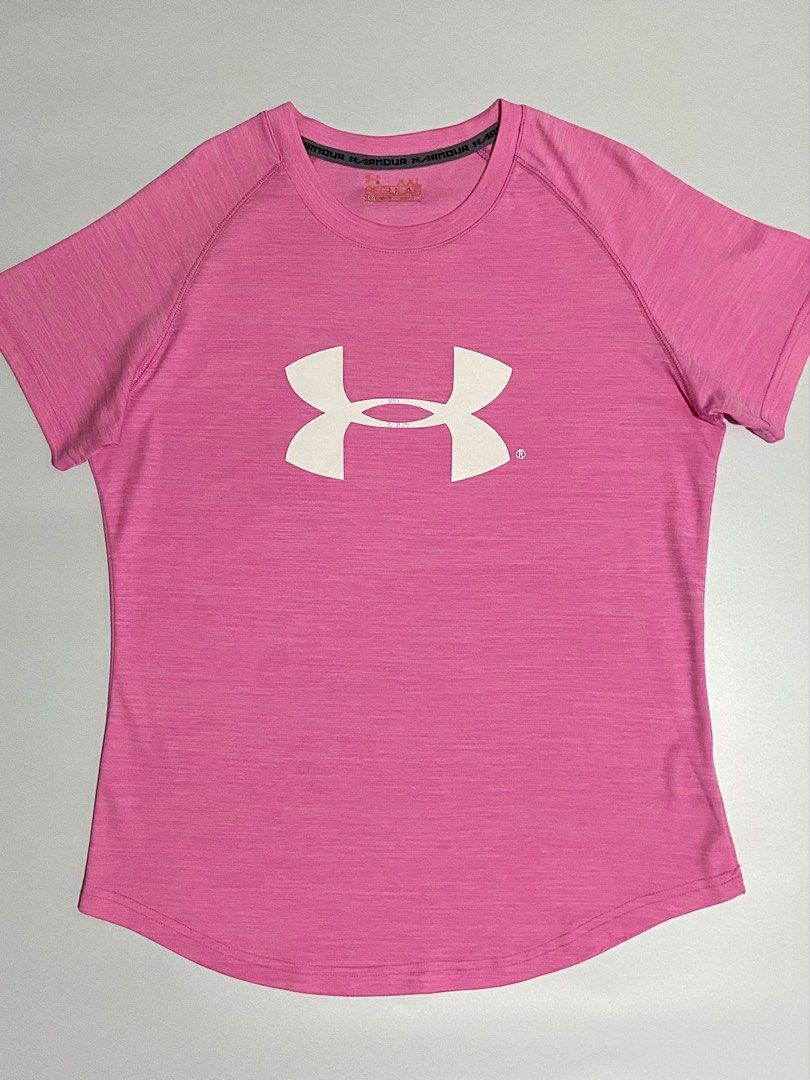 Bright Pink Under Armour Drifit Shirt (Category: Activewear) located in Davao. Submitted by sb.thriftwear (Listing ID 1471146539, Image 1). Description: Size: L-XL Dimensions: W- 19.5” L- 26” Issue: Hairline on front and back print, and pinhole at the back (see photos) Color may vary due to lighting. ⚠️All items are thrifted. Please manage your expectations..