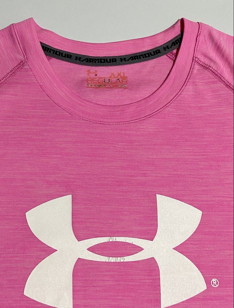 Bright Pink Under Armour Drifit Shirt (Category: Activewear) located in Davao. Submitted by sb.thriftwear (Listing ID 1471146539, Image 2). Description: Size: L-XL Dimensions: W- 19.5” L- 26” Issue: Hairline on front and back print, and pinhole at the back (see photos) Color may vary due to lighting. ⚠️All items are thrifted. Please manage your expectations..