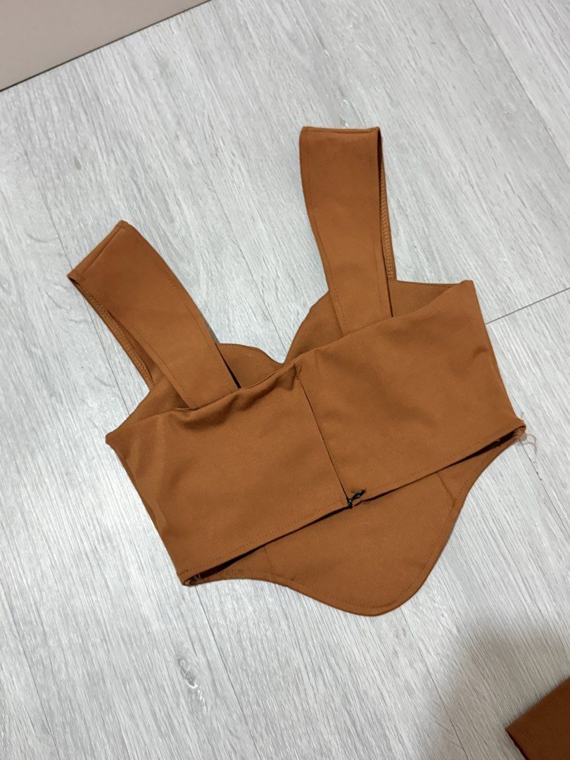 Brown Crop Top and Shorts Set Terno (Category: Sets or Coordinates) located in Manila. Submitted by prelovedbychellyy (Listing ID 1471185124, Image 2). Description: FITS XS TO SMALL FRAME bought in BKK - Color: brown - Set includes: Crop top and high-waisted shorts - Top details: Sweetheart neckline, pointed front hem, wide straps - Bottoms details: Tailored seams, back zipper closure - Material: Smooth fabric with slight stretch - Condition: Wor
