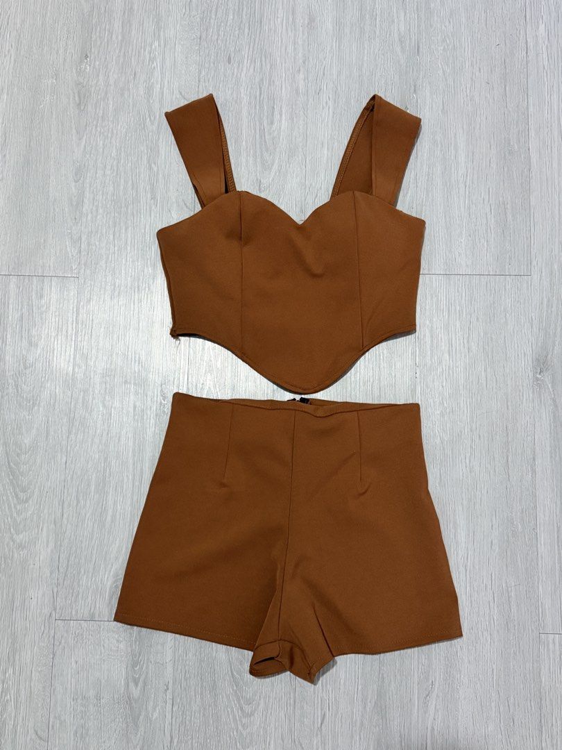 Brown Crop Top and Shorts Set Terno (Category: Sets or Coordinates) located in Manila. Submitted by prelovedbychellyy (Listing ID 1471185124, Image 1). Description: FITS XS TO SMALL FRAME bought in BKK - Color: brown - Set includes: Crop top and high-waisted shorts - Top details: Sweetheart neckline, pointed front hem, wide straps - Bottoms details: Tailored seams, back zipper closure - Material: Smooth fabric with slight stretch - Condition: Wor