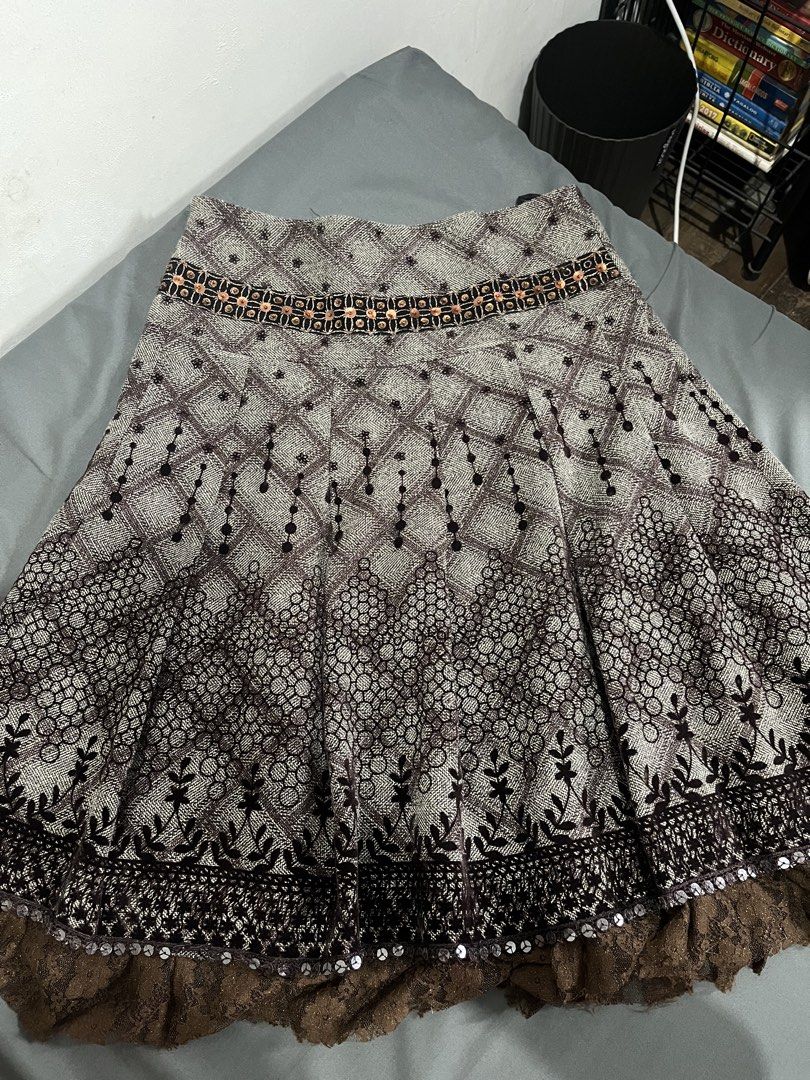 Brown Patterned Pleated Skirt (Category: Skirts) located in Manila. Submitted by vin_take (Listing ID 1471274295, Image 2). Description: - Size: S - Design: Brown geometric and floral prints with sequin accents - Details: Beautiful brown lace trim at the bottom hem - Comfort: Fully lined interior - Style: Pleated skirt.