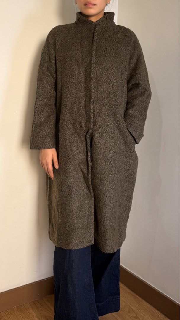 Brown Wool Blend Oversized Winter Long Coat (Category: Coats, Jackets and Outerwear) located in Quezon City. Submitted by cristealyanna (Listing ID 1471140097, Image 2). Description: - Color: Brown - Material: Textured wool - Length: Mid-calf - Fit: Relaxed - Features: High collar, front buttons, deep side pockets - Style: Versatile layering piece for chilly weather.