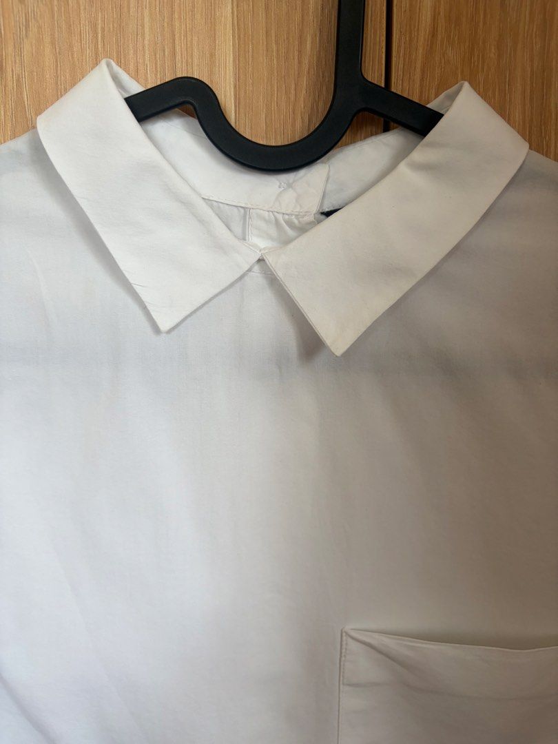 Bundle: White Wrap Crop Top and White Collared Shirt (Category: Blouses) located in Cebu City. Submitted by wearjane.54 (Listing ID 1471124529, Image 3). Description: - Bundle of 2 white tops - Item 1: Cropped wrap top with side tie - Item 2: Short-sleeve collared shirt with chest pocket - Flaw note: Small spot near the collar of the button-up shirt - Both are lightweight and easy to style with high-waist bottoms - Clean overall condition.