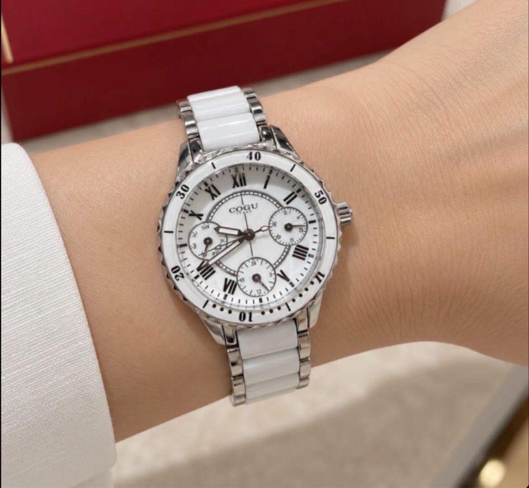 C0GU Italy quartz wristwatch (Category: Women's Watches) located in Manila. Submitted by annafinds (Listing ID 1471286057, Image 2). Description: C0GU Italy quartz wristwatch featuring a white dial with Roman numerals, a white-accented rotating bezel, and a ceramic and-silver link bracelet. ₱3,999 Open for layaway..