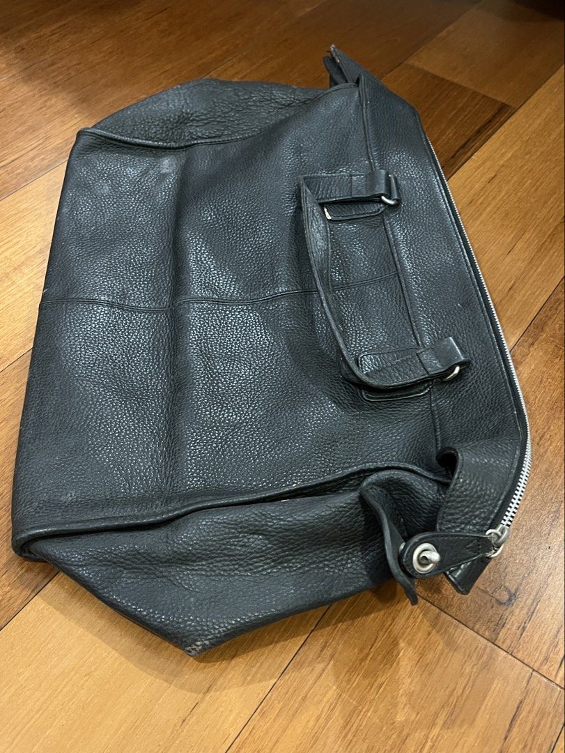 Calvin Klein Black Leather Tote Handbag (Category: Luxury Bags & Wallets) located in San Juan City. Submitted by thrillfinder (Listing ID 1471131046, Image 2). Description: - Brand: Calvin Klein - Material: Black pebbled leather - Closure: Secure top zip - Handles: Dual top handles for easy carrying. Can be used as handcarry for traveling - Interior: Fabric lined with a zippered pocket and CK logo patch - Protection: Metal feet on the bottom - Co