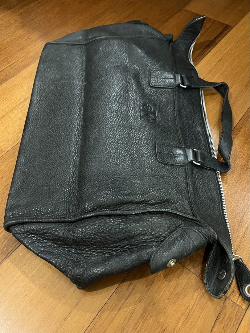 Calvin Klein Black Leather Tote Handbag (Category: Luxury Bags & Wallets) located in San Juan City. Submitted by thrillfinder (Listing ID 1471131046, Image 1). Description: - Brand: Calvin Klein - Material: Black pebbled leather - Closure: Secure top zip - Handles: Dual top handles for easy carrying. Can be used as handcarry for traveling - Interior: Fabric lined with a zippered pocket and CK logo patch - Protection: Metal feet on the bottom - Co