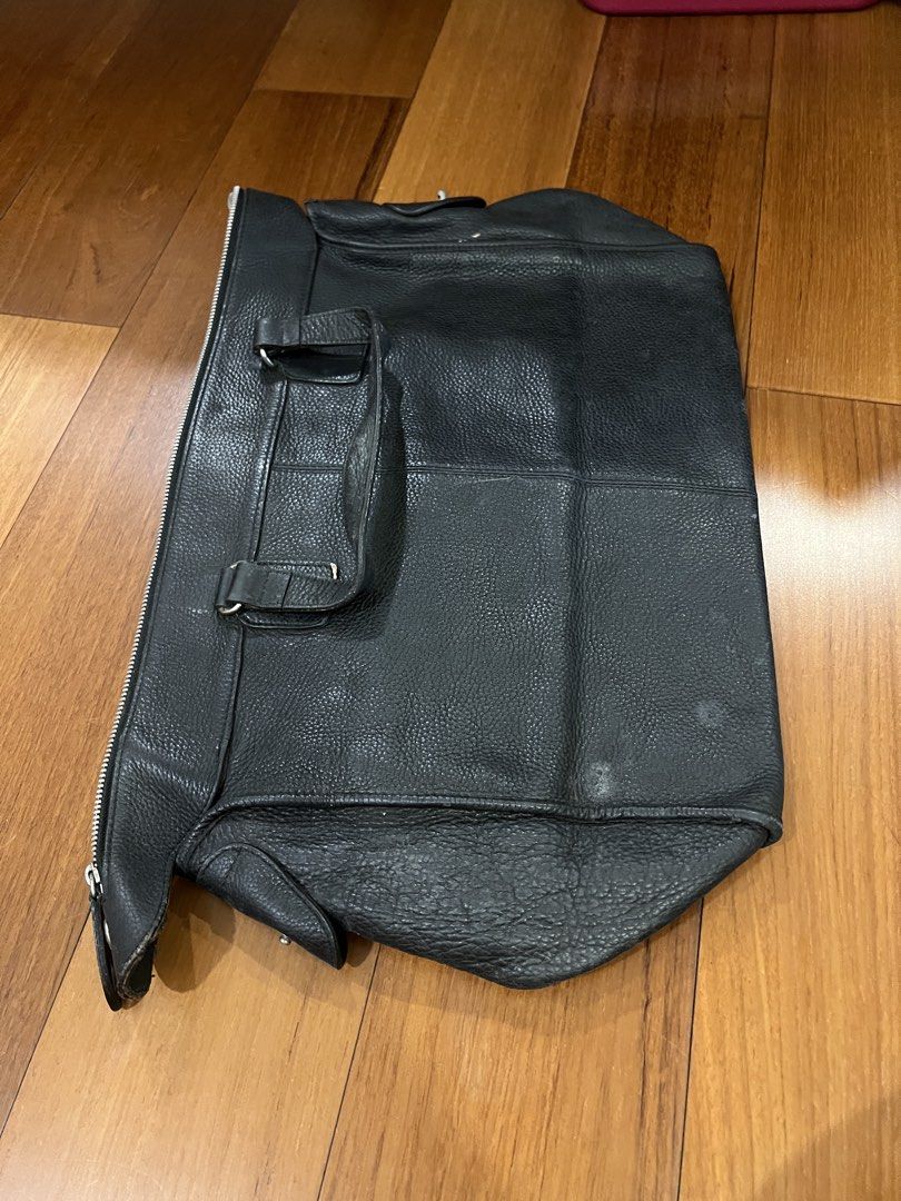 Calvin Klein Black Leather Tote Handbag (Category: Luxury Bags & Wallets) located in San Juan City. Submitted by thrillfinder (Listing ID 1471131046, Image 3). Description: - Brand: Calvin Klein - Material: Black pebbled leather - Closure: Secure top zip - Handles: Dual top handles for easy carrying. Can be used as handcarry for traveling - Interior: Fabric lined with a zippered pocket and CK logo patch - Protection: Metal feet on the bottom - Co