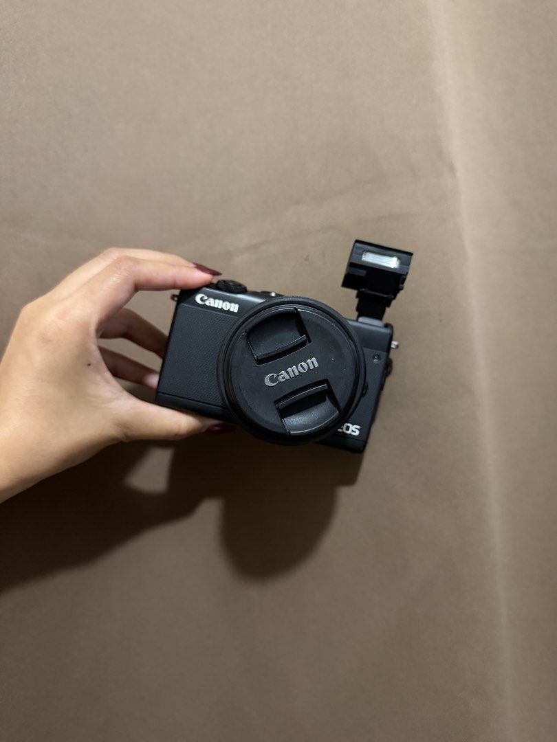 Canon EOS M100 Mirrorless Camera with 15-45mm Lens (Category: Cameras) located in Valenzuela. Submitted by 4yemami (Listing ID 1471194946, Image 3). Description: FOR SALE | 2ND HAND CANON EOS M100 with 15-45mm lens and accessoriess Mirrorless Camera Cash/Online Price: P25,000 only! Actual photos posted. Ready to use na po 10/10 Performance (No issue) 10/10 Glass 9/10 Cosmetics (In good condition; minimal signs of usage) INCLUSIONS: - CAMERA BAG -