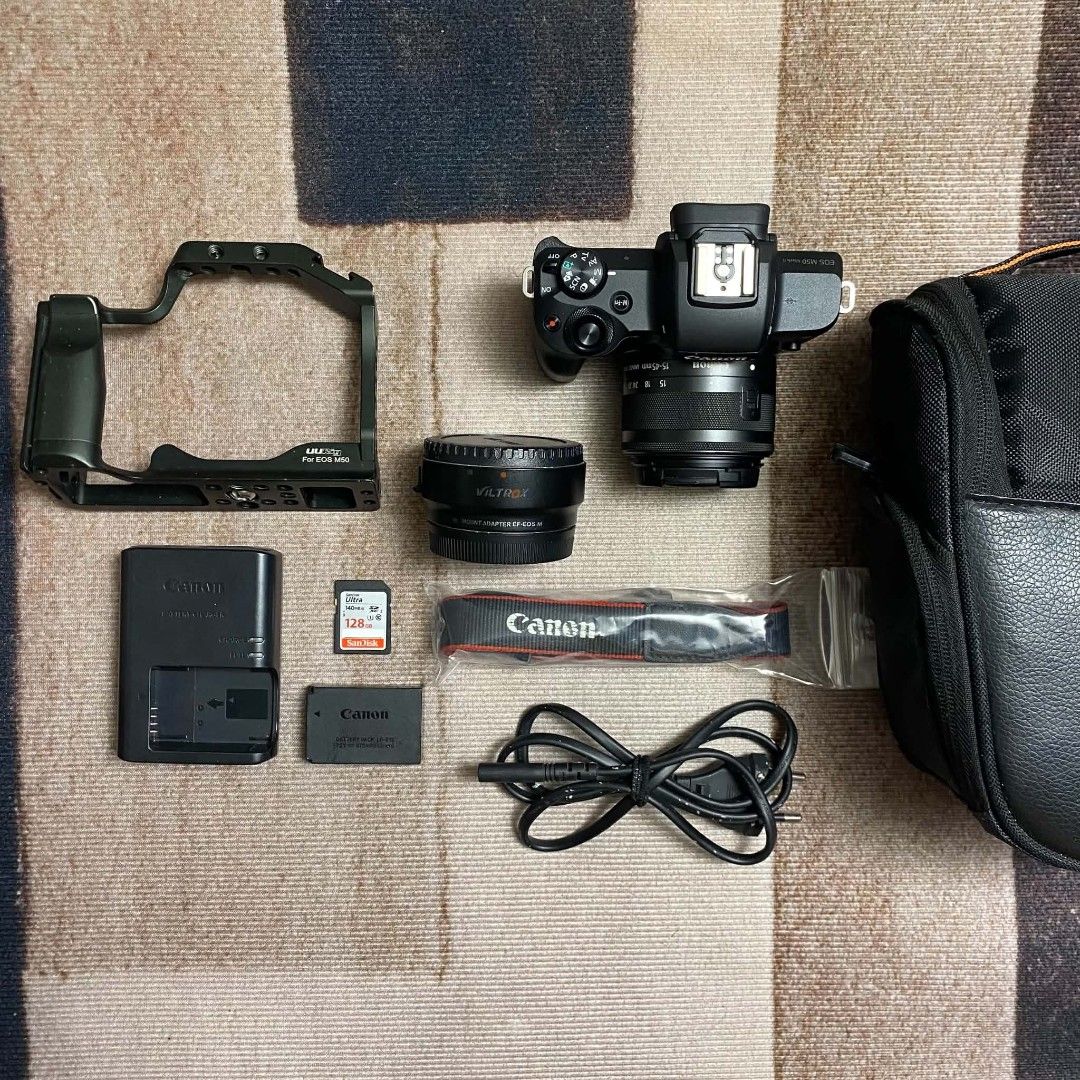 Canon EOS M50 Mark II Mirrorless Camera Kit (Category: Cameras) located in Rodriguez. Submitted by tan_13 (Listing ID 1471194811, Image 1). Description: - Canon EOS M50 Mark II camera body with 15-45mm lens - Extremely low shutter count: under 1,000 actuations - Includes EF-EOS M mount adapter and Viltrox adapter - Comes with a protective camera cage and 128GB SanDisk Ultra SD card - Includes original battery, charger, power cord, strap, and carr