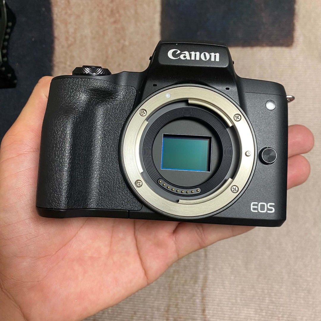 Canon EOS M50 Mark II Mirrorless Camera Kit (Category: Cameras) located in Rodriguez. Submitted by tan_13 (Listing ID 1471194811, Image 3). Description: - Canon EOS M50 Mark II camera body with 15-45mm lens - Extremely low shutter count: under 1,000 actuations - Includes EF-EOS M mount adapter and Viltrox adapter - Comes with a protective camera cage and 128GB SanDisk Ultra SD card - Includes original battery, charger, power cord, strap, and carr