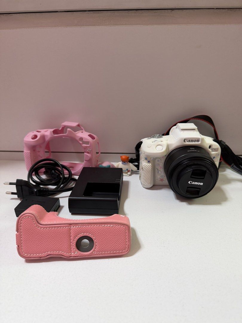 Canon EOS R50 with RF 1.8 50mm lens (Category: Cameras) located in Manila. Submitted by kiramae_ (Listing ID 1471165674, Image 1). Description: canon eos r50 - no issues around 1.5 years old inclusions: camera body, lens, strap, lens cap, screen protector, original charger, 2 batteries, 3 silicone cases, 1 hard case, 2 sanrio accessories loc: manila delivery through lalamove/grab payment: gcash sf handled by buyer.