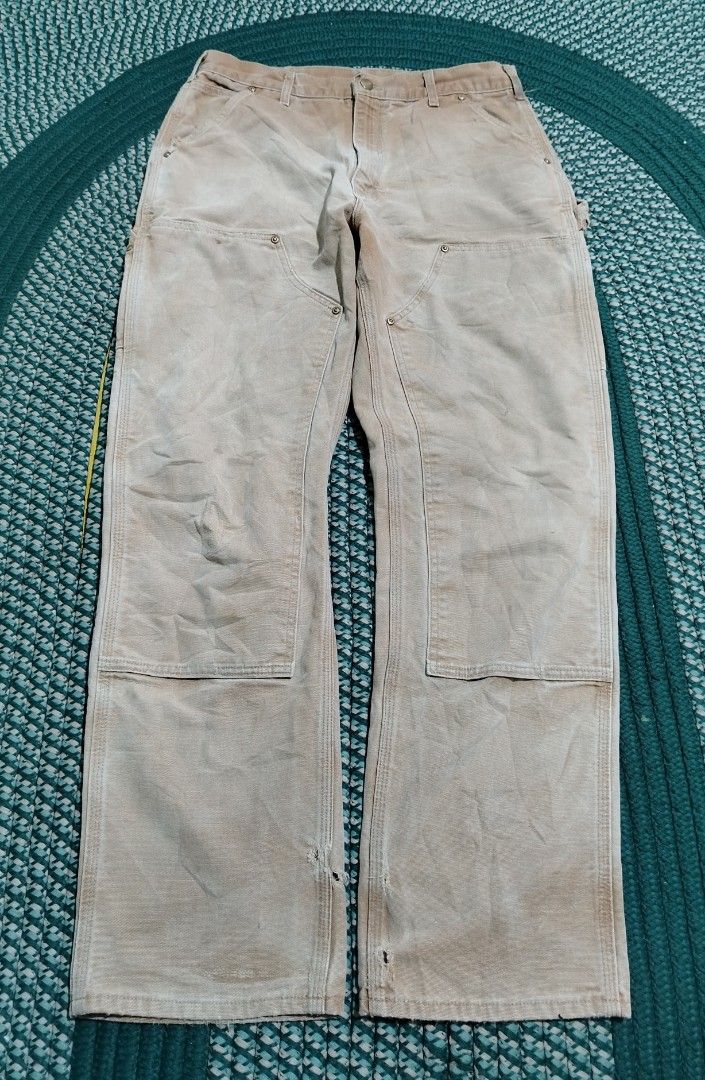 Carhartt Double Front Work Pants Tan (Category: Jeans) located in Lucena. Submitted by thrifteditem (Listing ID 1471207087, Image 1). Description: - Authentic Carhartt double-front work pants in classic tan duck canvas - Built for durability with heavy-duty cotton construction and metal rivets at stress points - Equipped with practical utility pockets and a back hammer loop - Genuine worn-in character with natural fading from actual job site use 