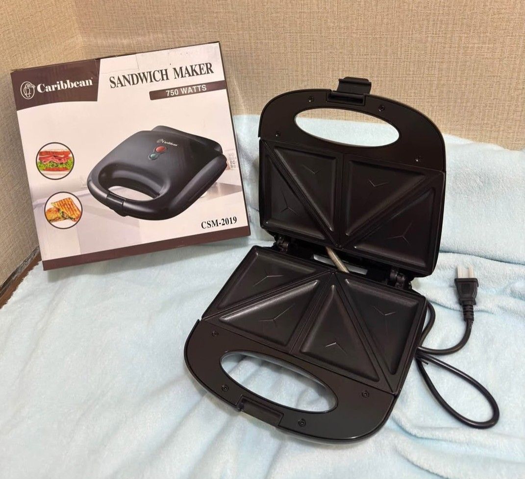 Caribbean Sandwich Maker (Model: CSM-2019) (Category: Breadmakers) located in Valenzuela. Submitted by justgorjas (Listing ID 1471255198, Image 1). Description: Lalamove pooling only. Please check the shipping fee/price before messaging me. Location: Malanday, Valenzuela City Capacity: 2-slice / 4 triangular sandwich sections brand: Carribean, China made.