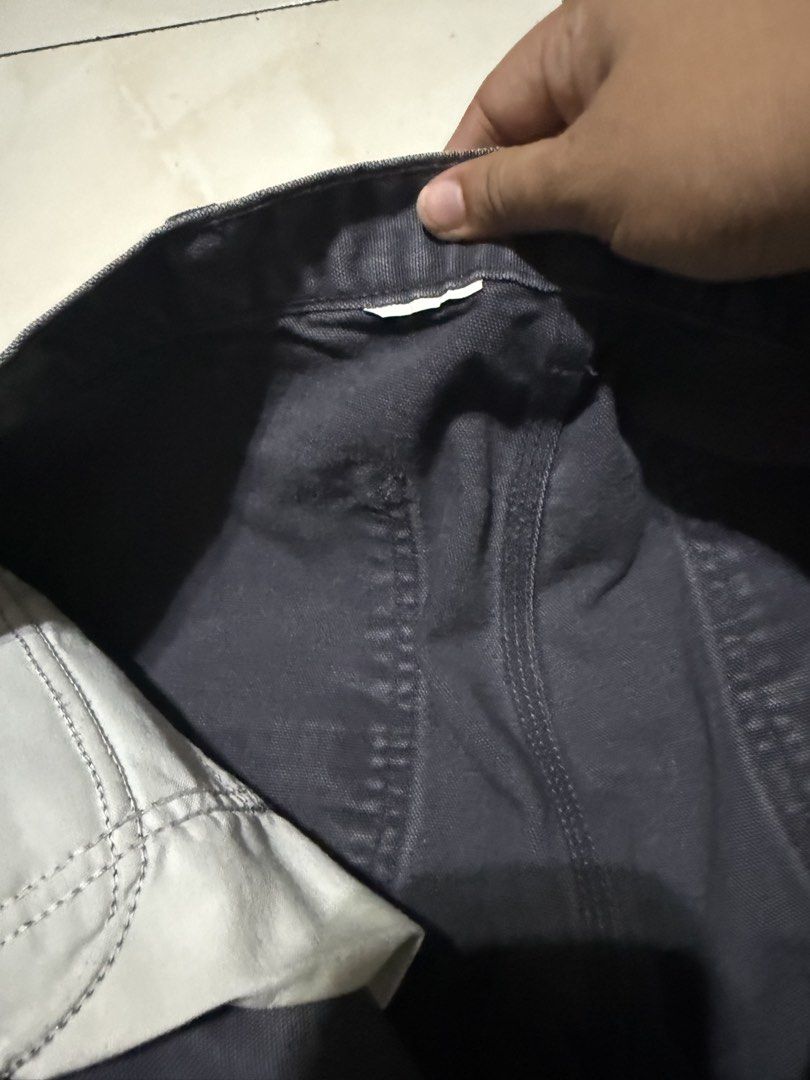 Carthus Dark Grey Carpenter Pants Canvas Workwear (Category: Jeans) located in Davao. Submitted by nobleangel (Listing ID 1471137443, Image 2). Description: - Brand/Model: Carthus Carpenter Pants - Color: Dark grey with slight fading - Material: Heavy cotton canvas - Features: Tool pockets, hammer loop, and woven brand patch - Fit: Regular fit with wide legs - Condition: Pre-loved with minor wear marks.