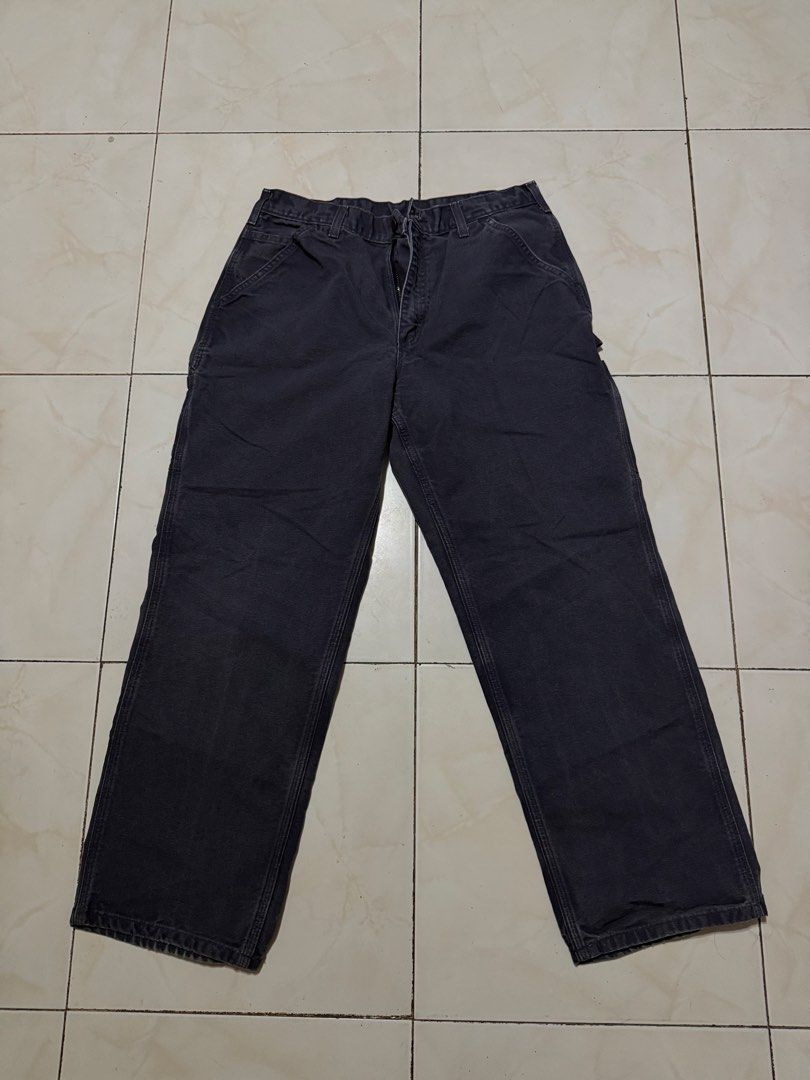 Carthus Dark Grey Carpenter Pants Canvas Workwear (Category: Jeans) located in Davao. Submitted by nobleangel (Listing ID 1471137443, Image 1). Description: - Brand/Model: Carthus Carpenter Pants - Color: Dark grey with slight fading - Material: Heavy cotton canvas - Features: Tool pockets, hammer loop, and woven brand patch - Fit: Regular fit with wide legs - Condition: Pre-loved with minor wear marks.
