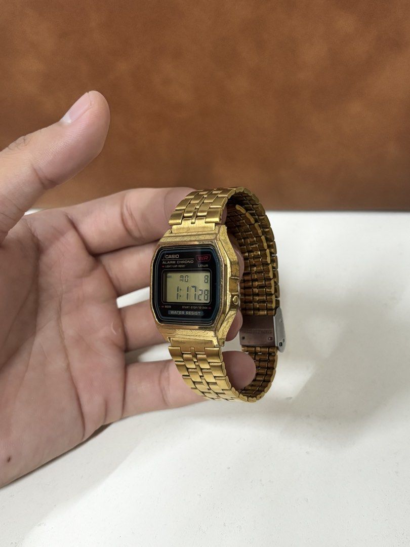 Casio A159WGE Gold Vintage Digital Watch (Category: Women's Watches) located in Manila. Submitted by mharkie (Listing ID 1471285330, Image 3). Description: - Iconic retro gold-tone Casio digital watch with stainless steel back (Module 593, Japan DH) - Fully functioning digital display featuring time, date, alarm, and stopwatch - Adjustable link bracelet with secure stainless steel clasp - Exhibits natural scuffs and vintage patina from regular we