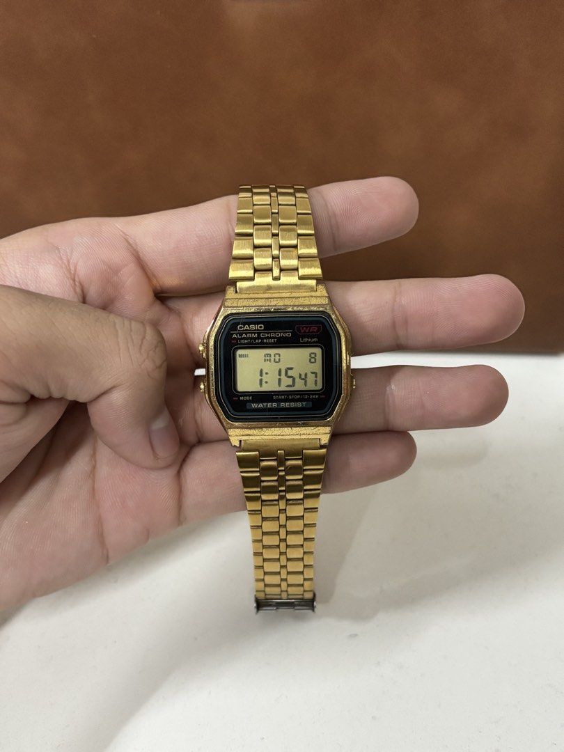 Casio A159WGE Gold Vintage Digital Watch (Category: Women's Watches) located in Manila. Submitted by mharkie (Listing ID 1471285330, Image 1). Description: - Iconic retro gold-tone Casio digital watch with stainless steel back (Module 593, Japan DH) - Fully functioning digital display featuring time, date, alarm, and stopwatch - Adjustable link bracelet with secure stainless steel clasp - Exhibits natural scuffs and vintage patina from regular we