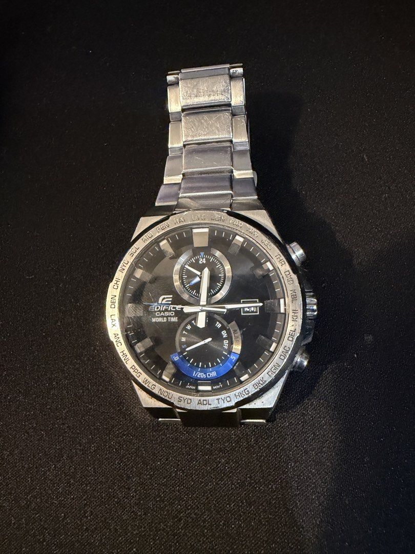 Casio Edifice World Time Chronograph Watch (Category: Men's Watches) located in Quezon City. Submitted by raphjohn (Listing ID 1471176357, Image 2). Description: - Authentic Casio Edifice chronograph watch - Sleek black dial with silver hands and eye-catching blue accents - Equipped with a practical world time bezel and date window - Durable stainless steel bracelet and clasp - Accurate timekeeping for reliable everyday wear - Condition: Shows vi