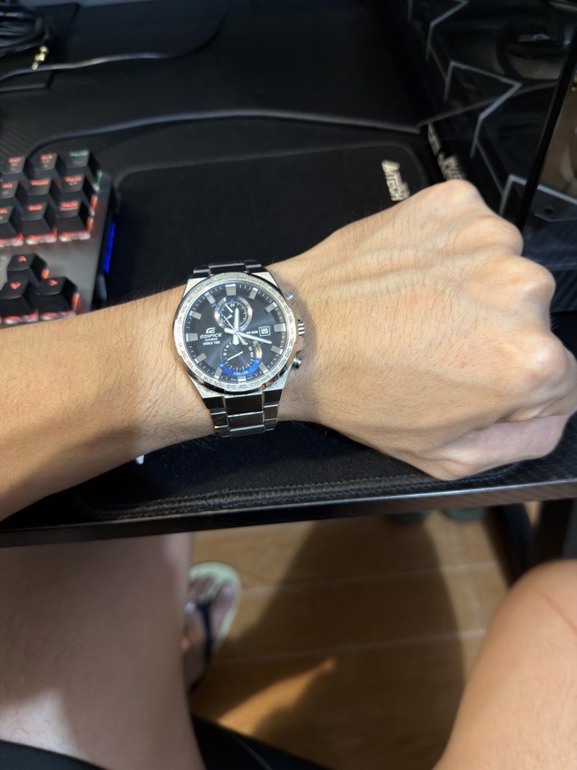 Casio Edifice World Time Chronograph Watch (Category: Men's Watches) located in Quezon City. Submitted by raphjohn (Listing ID 1471176357, Image 3). Description: - Authentic Casio Edifice chronograph watch - Sleek black dial with silver hands and eye-catching blue accents - Equipped with a practical world time bezel and date window - Durable stainless steel bracelet and clasp - Accurate timekeeping for reliable everyday wear - Condition: Shows vi