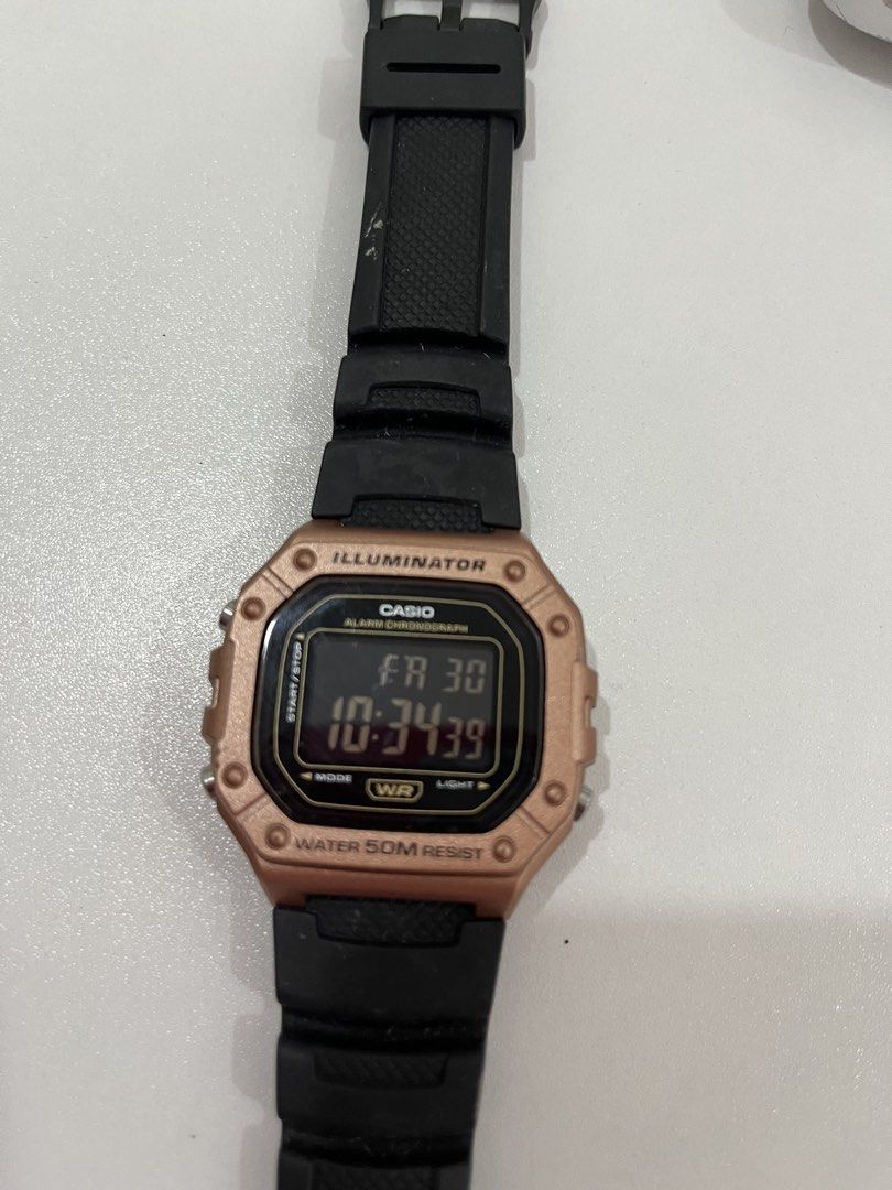 Casio Illuminator and UniSilver Quartz Watch Bundle (Category: Women's Watches) located in Rizal. Submitted by oncelove143 (Listing ID 1471138976, Image 2). Description: - Watch 1: Casio Illuminator digital watch, trendy rose gold case with a durable black strap, and 50m water resistance. - Watch 2: Dark blue UniSilver analog watch featuring fun, colorful numbers and a charming heart marker at the bottom. - Both watches come with straps already a