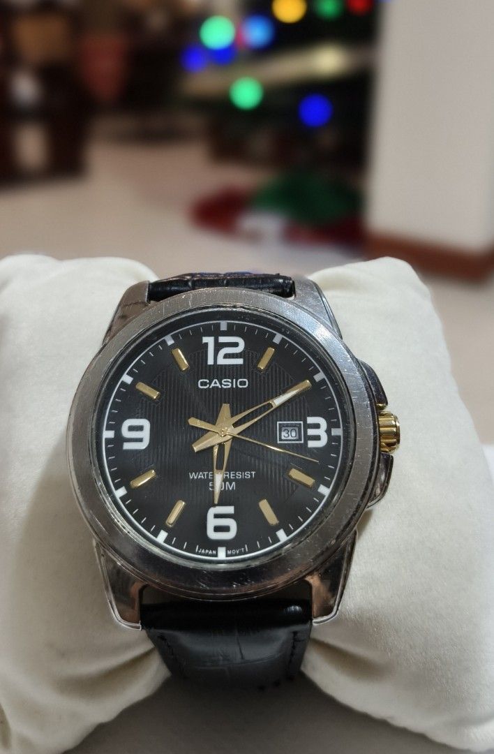 Casio MTP-1314 Quartz Watch with Black Leather Strap (Category: Men's Watches) located in Angono. Submitted by allenpaul26 (Listing ID 1471138147, Image 1). Description: - Brand: Casio (Model: MTP-1314) - Dial: Black textured dial with gold-tone hands and large Arabic numerals - Features: Date display window at 3 o'clock - Build: Stainless steel case with genuine black leather strap - Movement: Reliable Japan movement - Water Resistance: Up to 50