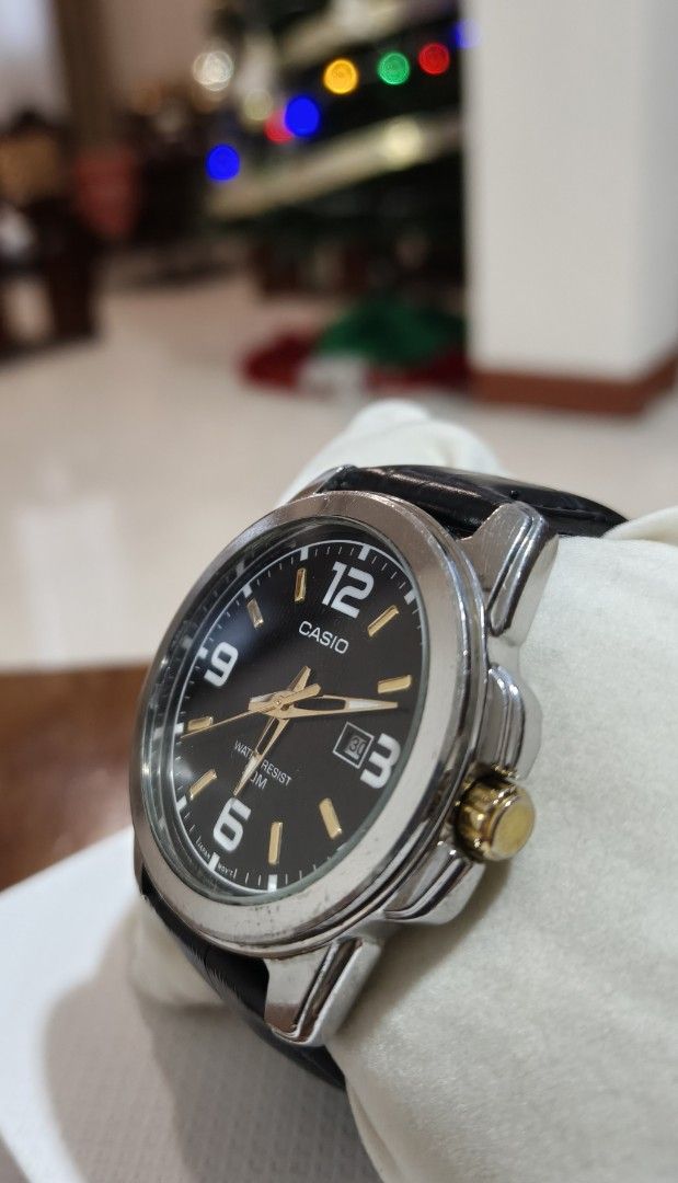 Casio MTP-1314 Quartz Watch with Black Leather Strap (Category: Men's Watches) located in Angono. Submitted by allenpaul26 (Listing ID 1471138147, Image 2). Description: - Brand: Casio (Model: MTP-1314) - Dial: Black textured dial with gold-tone hands and large Arabic numerals - Features: Date display window at 3 o'clock - Build: Stainless steel case with genuine black leather strap - Movement: Reliable Japan movement - Water Resistance: Up to 50