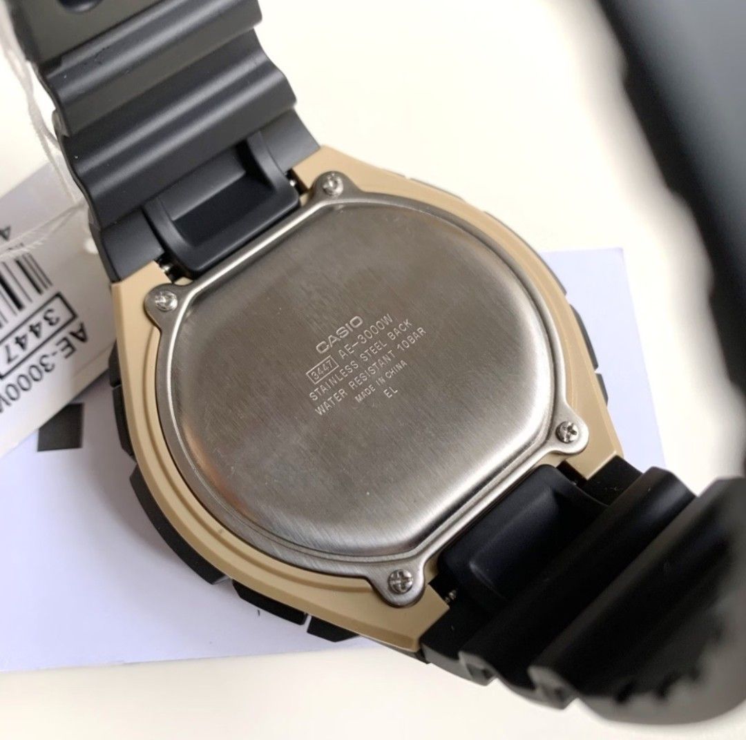 Casio World Time Illuminator AE-3000W Digital Watch (Category: Men's Watches) located in Mandaluyong City. Submitted by 54fleetfoot (Listing ID 1471176462, Image 1). Description: - Model: Casio AE-3000W (Module 3447) - Design: Black resin strap with a stylish gold-tone bezel and stainless steel case back - Display: Clean glass face with minor hairline scratches, 100% fully working digital display - Key Features: World time function with multiple 