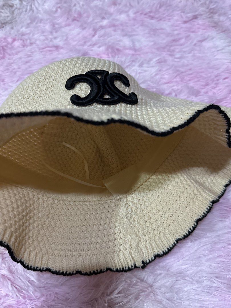 Celine Knit Bucket Hat Beige Black (Category: Hats & Beanies) located in Bacoor. Submitted by micsr (Listing ID 1471223871, Image 3). Description: - Color: Beige knit with black brim trim - Design: Iconic black embroidered Celine Triomphe logo on the front - Material: Soft woven texture with a comfortable inner lining ribbon - Style: Trendy and versatile sunny day accessory.