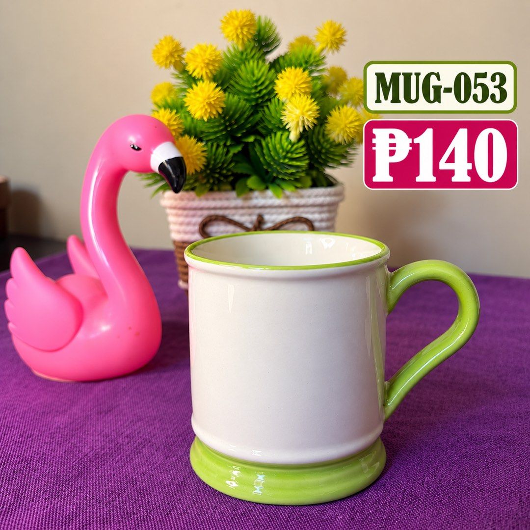 Ceramic Mug White with Green Handle and Rim MUG-053 (Category: Coffee & Tea Tableware) located in Manila. Submitted by zamarah08 (Listing ID 1471208340, Image 1). Description: - Color: White ceramic with green handle, rim, and base - Design: Simple and clean solid color style - Versatile: Perfect for daily coffee, tea, or milk - Build: Sturdy, high-quality ceramic - Size: Standard mug size for everyday use.