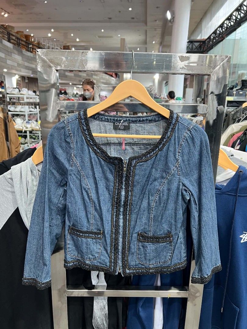 Chanel Denim Zip Jacket Size 2 (Category: Coats, Jackets and Outerwear) located in Urdaneta. Submitted by jayceegarage (Listing ID 1471290737, Image 1). Description: - Brand: Chanel - Item: Blue denim zip jacket - Size: 2 (Tag) - Material: 100% cotton - Details: Ornate dark trim along the neckline, zipper, pockets, and sleeve cuffs - Hardware: Metal YKK front zipper - Pockets: Front patch pockets - Origin: Made in China.