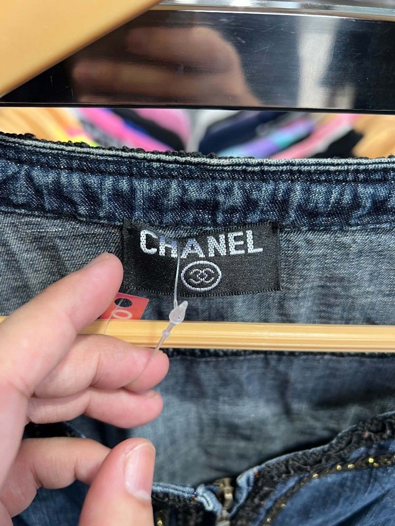 Chanel Denim Zip Jacket Size 2 (Category: Coats, Jackets and Outerwear) located in Urdaneta. Submitted by jayceegarage (Listing ID 1471290737, Image 2). Description: - Brand: Chanel - Item: Blue denim zip jacket - Size: 2 (Tag) - Material: 100% cotton - Details: Ornate dark trim along the neckline, zipper, pockets, and sleeve cuffs - Hardware: Metal YKK front zipper - Pockets: Front patch pockets - Origin: Made in China.