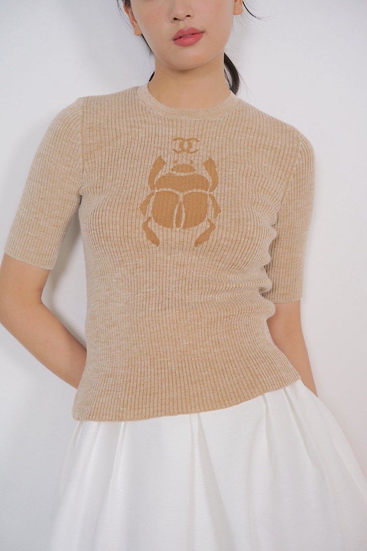 Chanel knit top (Category: Luxury Apparel) located in Marikina City. Submitted by joshuaades21107 (Listing ID 1471261113, Image 2). Description: Chanel knit top 36 on tag 17 width 22 length No issue bukod sa caretags na burado na .
