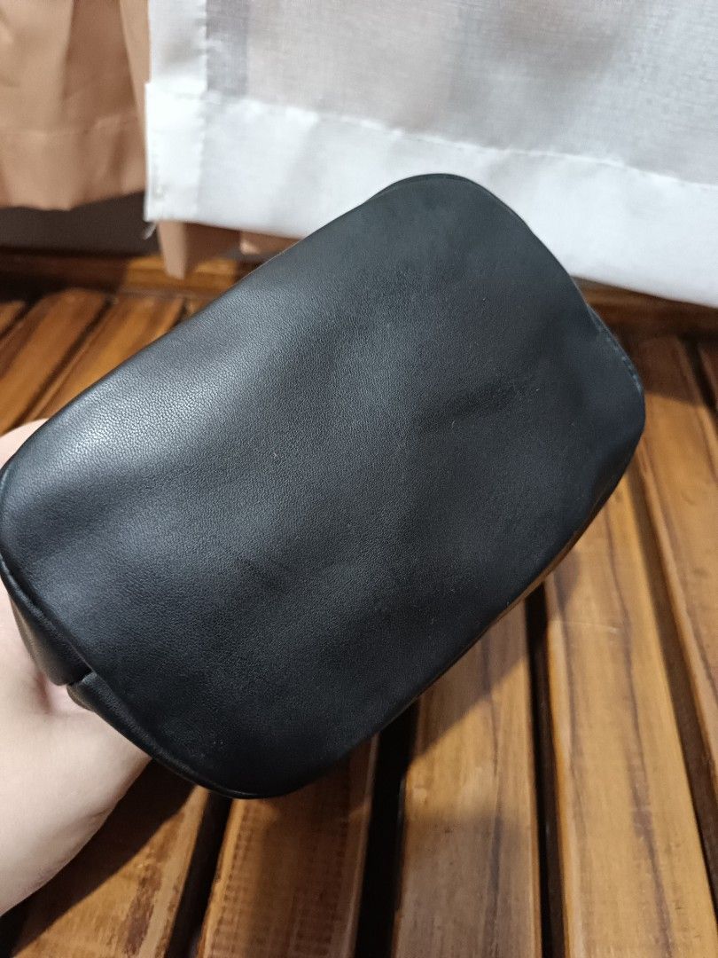 Charles & Keith Black Bucket Bag (Category: Shoulder Bags) located in Lucena. Submitted by jeankristi73450 (Listing ID 1471272810, Image 3). Description: - Brand: Charles & Keith - Style: Black bucket bag with gold-tone front hardware - Material: Polyurethane outer with cotton inner lining - Features: Adjustable shoulder strap, interior zip pocket, and clean bottom base - Condition: Brand new with tag still attached.
