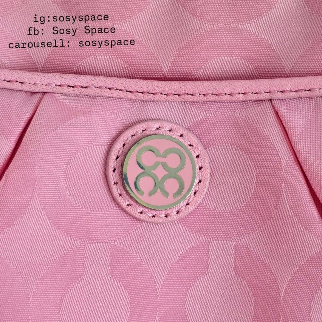 Coach Pink Crossbody Sling Bag (Category: Luxury Bags & Wallets) located in Lucena. Submitted by sosyspace (Listing ID 1471179165, Image 3). Description: C. O. A. C. H. 06B1P239 Op Art Signature Nylon Small Crossbody Sling Bag Interlocking to al Op Art logo pattern across a durable nylon jacquard fabric Silver-tone metal hardware Top zip closure Removable and adjustable strap Condition: PRE-OWNED Like new Never Used Minor signs that it was kept f