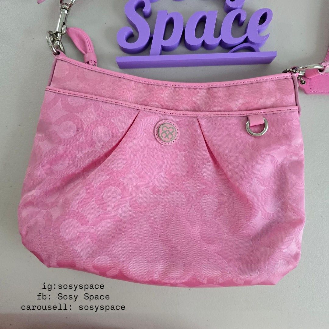 Coach Pink Crossbody Sling Bag (Category: Luxury Bags & Wallets) located in Lucena. Submitted by sosyspace (Listing ID 1471179165, Image 2). Description: C. O. A. C. H. 06B1P239 Op Art Signature Nylon Small Crossbody Sling Bag Interlocking to al Op Art logo pattern across a durable nylon jacquard fabric Silver-tone metal hardware Top zip closure Removable and adjustable strap Condition: PRE-OWNED Like new Never Used Minor signs that it was kept f