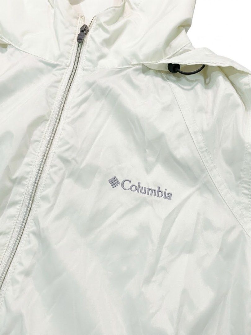 Columbia White Windbreaker Hooded Jacket (Category: Coats, Jackets and Outerwear) located in Manila. Submitted by antoncorr98797 (Listing ID 1471290281, Image 3). Description: Columbia Lightweight Windbreaker Jacket Condition: Excellent pre-owned condition Color: Off-white / Cream Size: Large (L) Features: Full-zip front, adjustable hood and hem drawstrings, and signature Columbia chest logo. Measurements (taken flat): Chest (Pit to Pit): 50 cm L