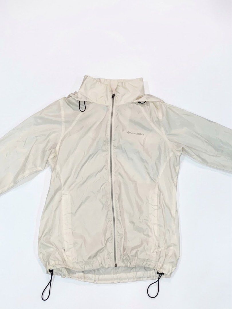 Columbia White Windbreaker Hooded Jacket (Category: Coats, Jackets and Outerwear) located in Manila. Submitted by antoncorr98797 (Listing ID 1471290281, Image 1). Description: Columbia Lightweight Windbreaker Jacket Condition: Excellent pre-owned condition Color: Off-white / Cream Size: Large (L) Features: Full-zip front, adjustable hood and hem drawstrings, and signature Columbia chest logo. Measurements (taken flat): Chest (Pit to Pit): 50 cm L