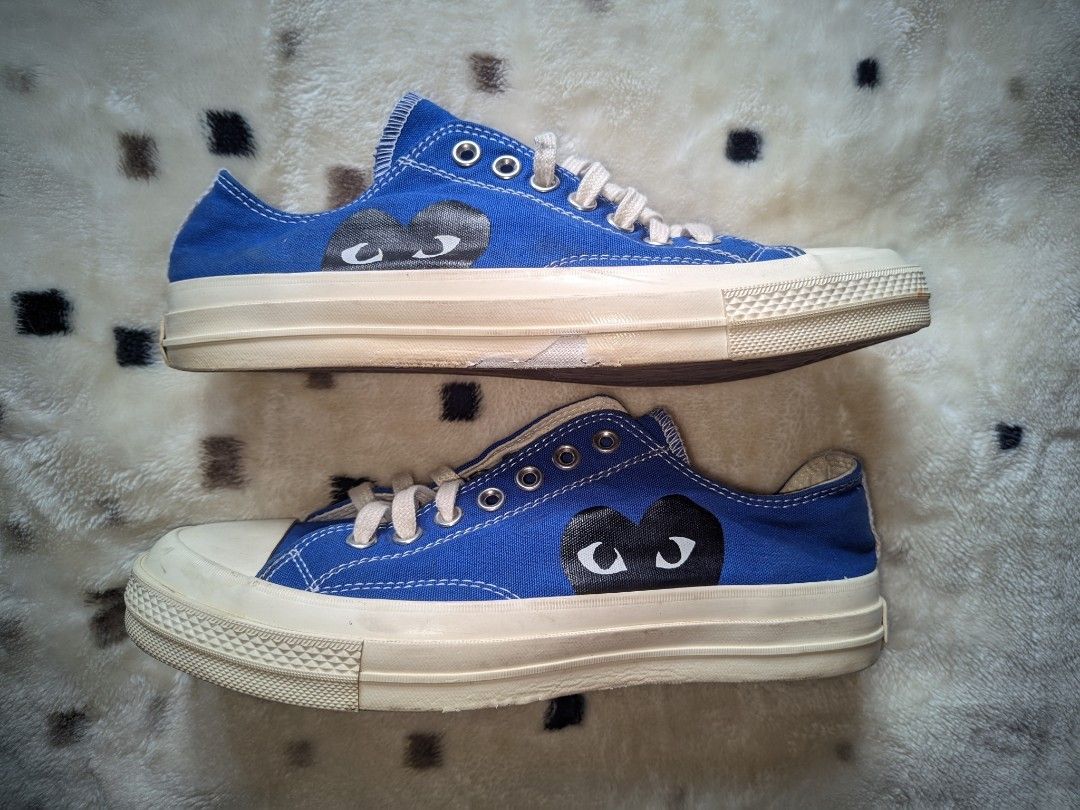 Comme des Garcons PLAY x Converse Chuck 70 Blue (Category: Sneakers) located in Caloocan City. Submitted by oddtiger_9f974a (Listing ID 1471193739, Image 3). Description: - Brand: Comme des Garçons PLAY x Converse - Style: Low-top canvas sneakers - Color: Blue with off-white midsole and brown waffle outsole - Design: Iconic heart and eyes graphic on side panels - Size: US Men's 9 / Women's 11 - Condition: Good, with slight scuffing on the midsole
