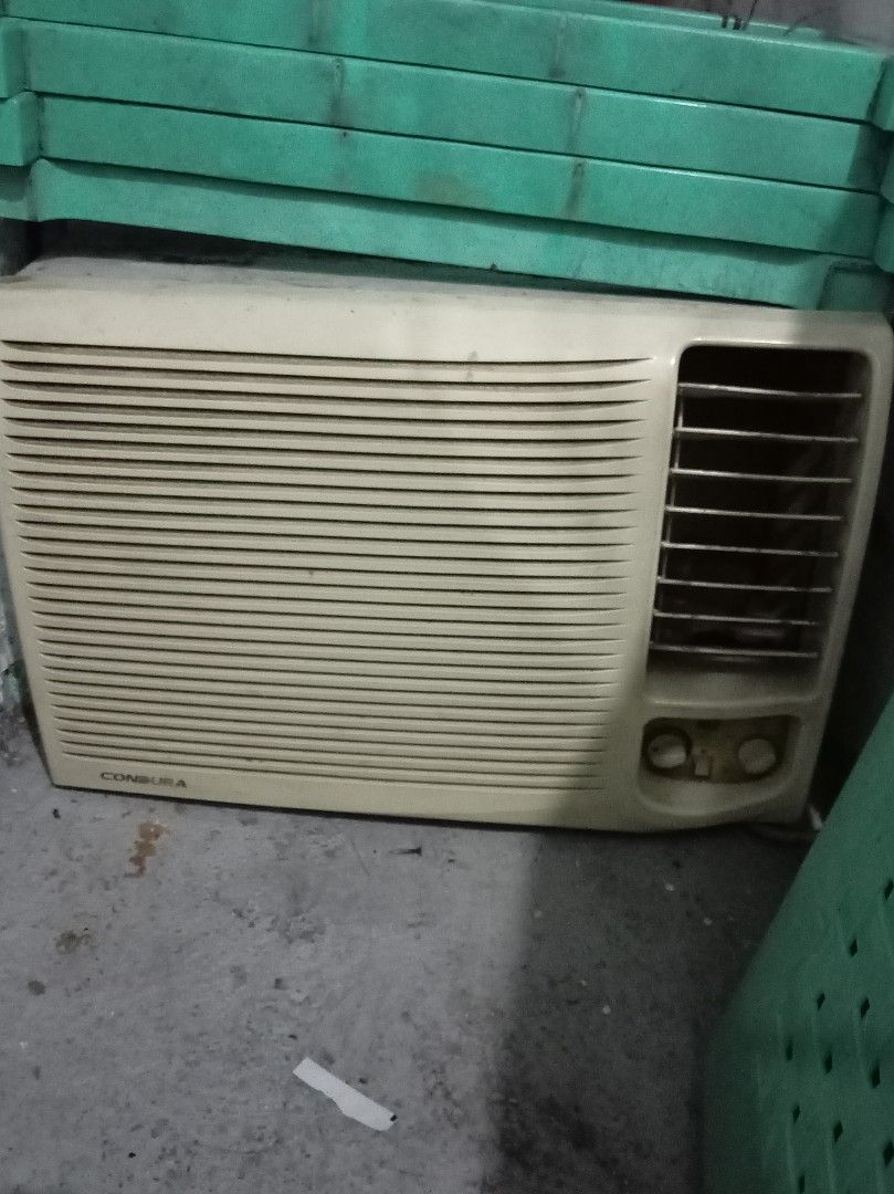 Condura Window Type Air Conditioner (Category: Air Conditioning and Heating) located in Caloocan City. Submitted by maynaito (Listing ID 1471130626, Image 2). Description: - Brand/Model: Condura Window Type Air Conditioner - Color: Off-White finish with louvered front intake - Controls: Standard manual knobs for temperature and fan speed - Condition: Powers on and cools normally, with minor dust and cosmetic wear from garage storage - Fit: Standa