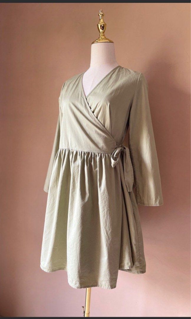 COS Green Wrap Dress with Pockets (Category: Dresses) located in Baguio. Submitted by the_general_store (Listing ID 1471142501, Image 3). Description: - Color: Sage green - Size: EUR XS (155/80A) to Small - Style: Wrap dress with long sleeves and a flared skirt - Details: Gathered waist with side tie - Bonus: Comes with convenient side pockets - Origin: Made in China.
