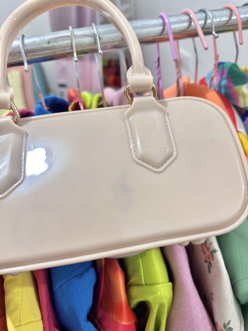 Cream bag with sling (Category: Cross-body Bags) located in Bulacan. Submitted by archivesbyjanine (Listing ID 1471234014, Image 3). Description: With minimal flaw, check 3rd photo.