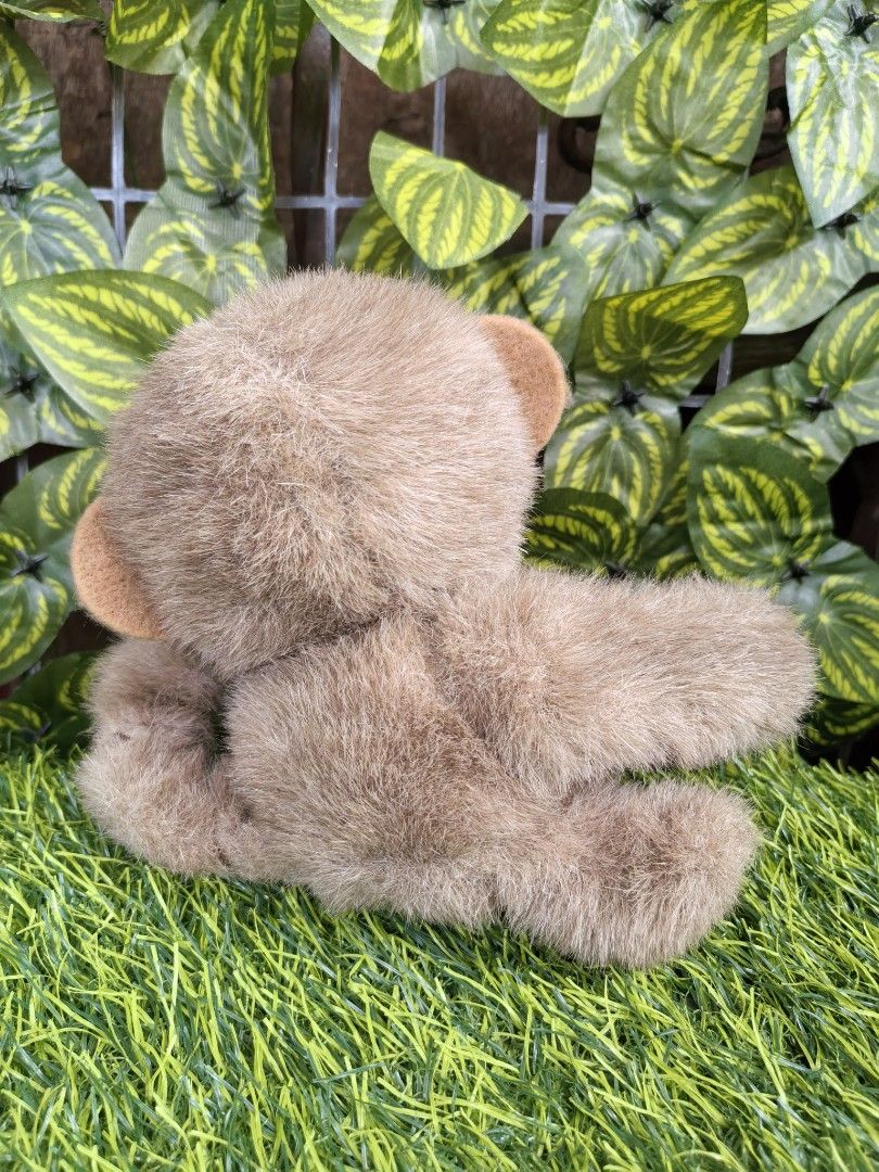 Cute fluffy brown monkey plush toy soft doll (Category: Plushies & Soft Toys) located in Paranaque City. Submitted by furugiyafinds (Listing ID 1471182895, Image 3). Description: - Super soft and fluffy brown fur with a lighter brown face and inner ears - Features adorable round black button eyes and a cute sitting pose with one paw raised - Clean and well-kept condition - Perfect cuddly buddy for kids or plush toy collectors - Small tag attached