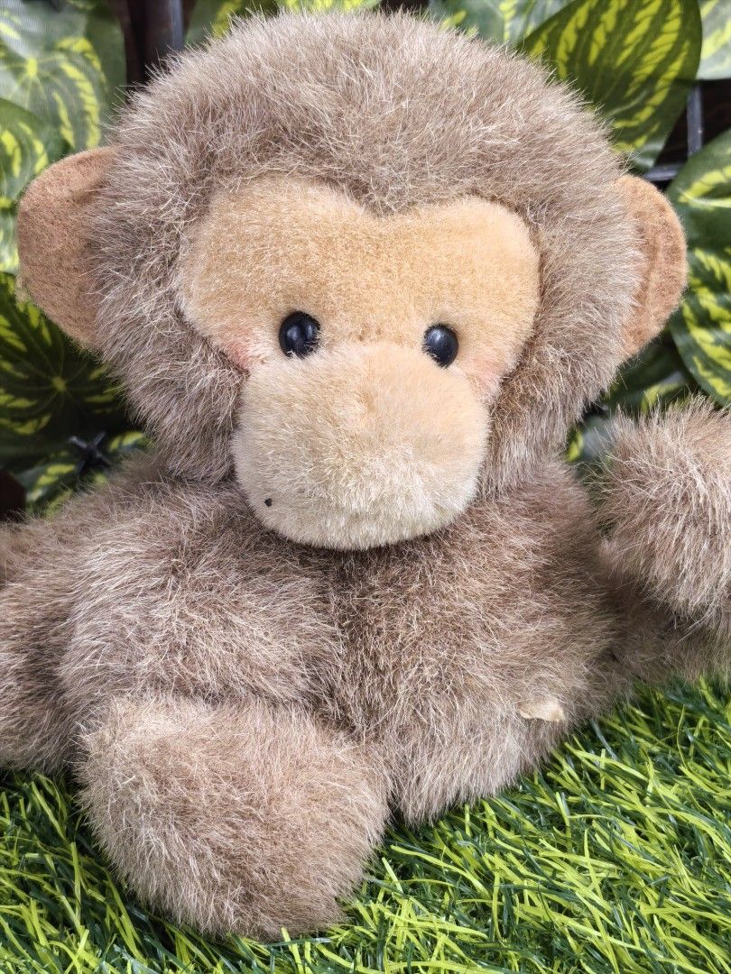 Cute fluffy brown monkey plush toy soft doll (Category: Plushies & Soft Toys) located in Paranaque City. Submitted by furugiyafinds (Listing ID 1471182895, Image 2). Description: - Super soft and fluffy brown fur with a lighter brown face and inner ears - Features adorable round black button eyes and a cute sitting pose with one paw raised - Clean and well-kept condition - Perfect cuddly buddy for kids or plush toy collectors - Small tag attached