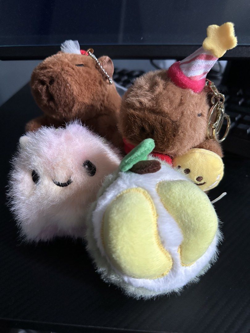 Cute keychains (Category: Plushies & Soft Toys) located in Singapore. Submitted by mr_sprinkles027p (Listing ID 1471156445, Image 1). Description: Durian - $5 Pink - $5 Capybara ( party hat ) - $6 Capybara ( bride ) - $6 All for $20.