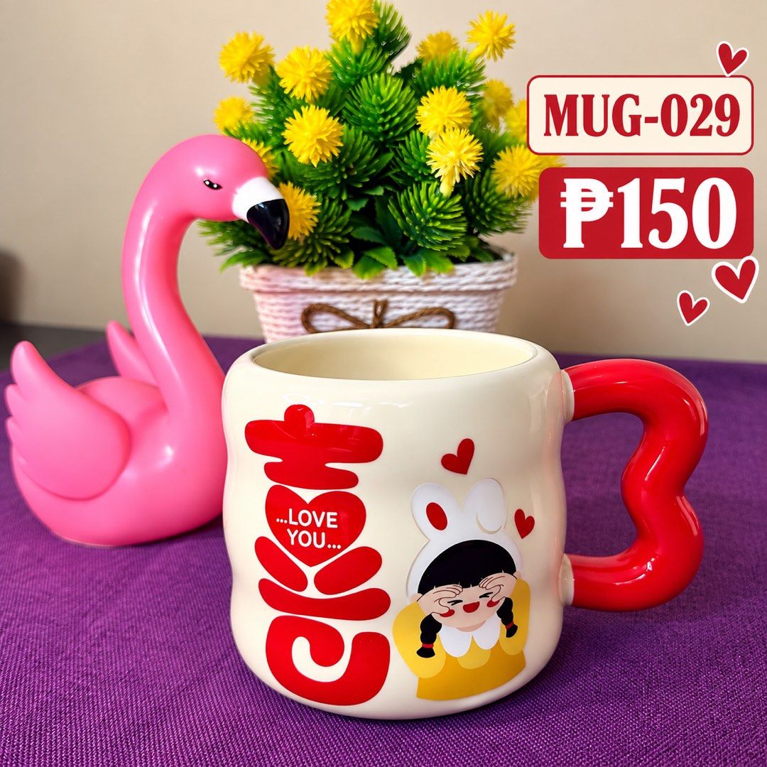Cute Love You Ceramic Mug with Red Handle (Category: Coffee & Tea Tableware) located in Manila. Submitted by zamarah08 (Listing ID 1471209299, Image 1). Description: - Material: Thick and sturdy ceramic - Design: Cream base with bold red 'Love You' text and adorable bunny-ear girl graphic - Feature: Eye-catching large red heart handle - Capacity: Ideal for morning coffee, tea, or your favorite hot drinks - Perfect for: Daily use or as a thoughtfu